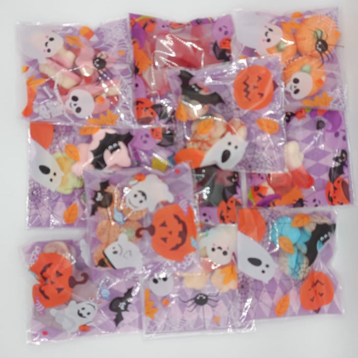 Set of Halloween-themed stickers in clear plastic bags on a white background